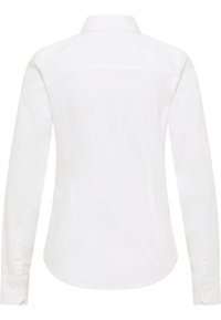 White long-sleeve shirt with a structured collar, button cuffs, and a curved hem. Made of smooth fabric with no visible patterns or accents.