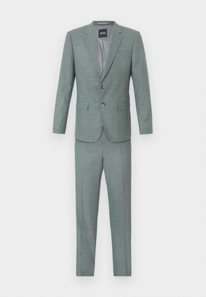 Light green suit with a textured finish, single-breasted jacket, notch lapels, and matching trousers. Features two front pockets and buttons.