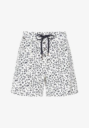 Spodenki w wzór panterki w białym kolorze z ciemnymi plamami, z wiązaniem w pasie, zapięciem na guzik oraz kieszeniami bocznymi. Wykonane z lekkiego materiału.