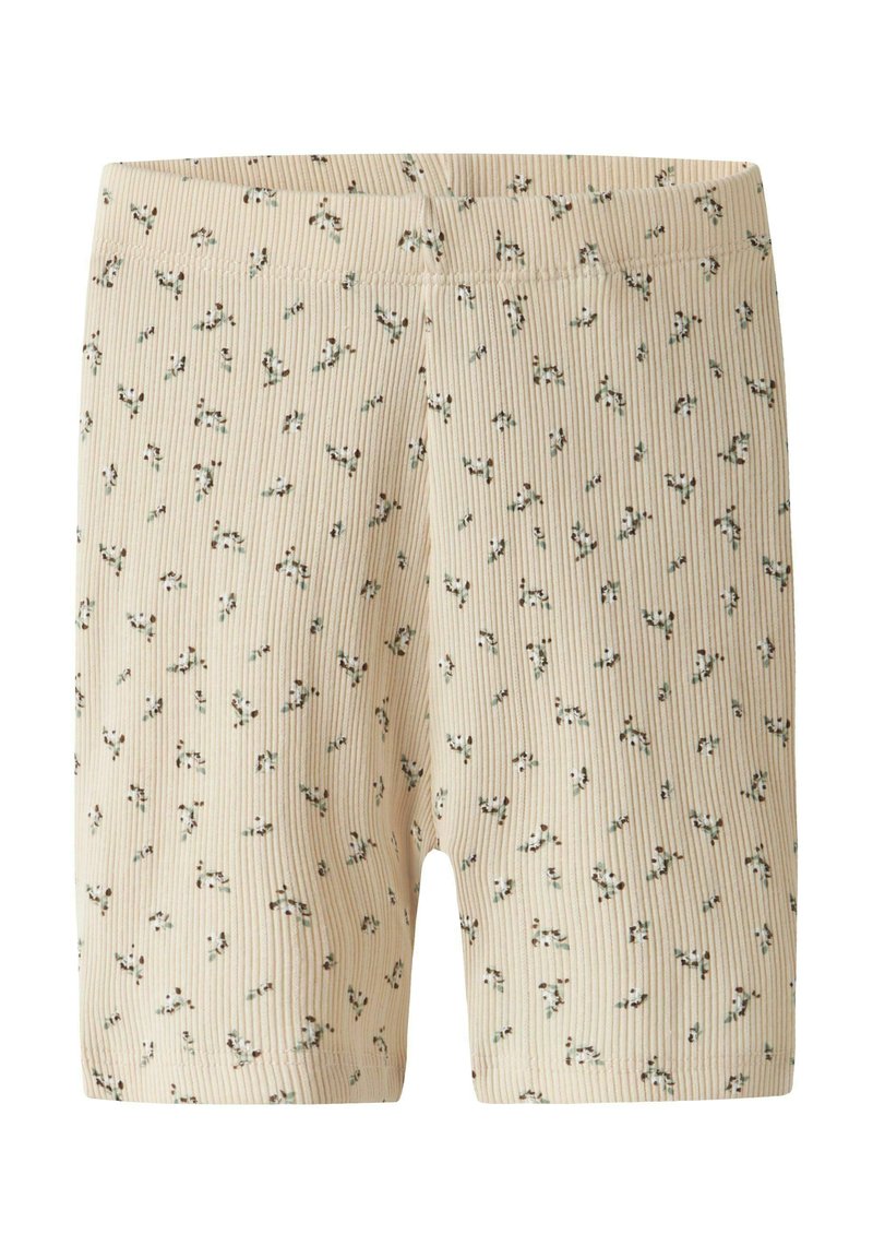 Bež kratke hlače s rebrastim uzorkom i malim zelenim i crnim cvjetnim motivima. Imaju elastičnu vrpcu u struku i dizajn koji doseže sredinu bedara.