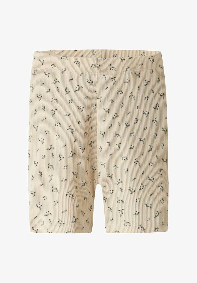 Bež kratke hlače s rebrastim uzorkom i malim zelenim i crnim cvjetnim motivima. Imaju elastičnu vrpcu u struku i dizajn koji doseže sredinu bedara.