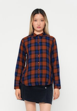 Ruitjesoverhemd in bruine, blauwe en oranje tinten, met een kraag, knoopsluiting en lange mouwen. Getextureerde stof met een relaxte pasvorm.