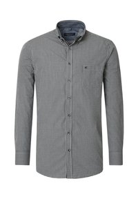 Karierte Button-up-Bluse in Schwarz und Weiß, mit langen Ärmeln, Kragen, Brusttasche und abgerundetem Saum. Der Stoff wirkt texturiert.