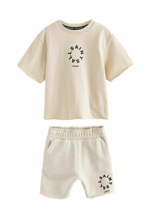 Béžové tričko s krátkym rukávom a šortky s elastickým pásom s čiernym okrúhlym logom "AllSaints London" na oboch dieloch.