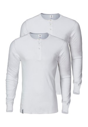 Long-sleeve white henley shirts made of soft cotton, featuring a round neckline, three-button placket, and ribbed cuffs.