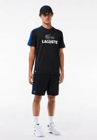 Lacoste Sport - Sporta šorti - black/globe-green Miniatūras attēls 1