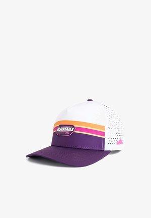 Man with short stubble wearing a white shirt and a white, purple, orange, and pink "BLACKSKIES PRO" cap, looking straight ahead.