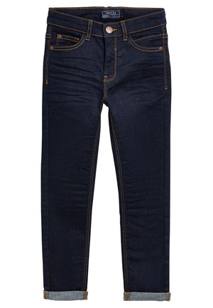 Jean slim ajusté bleu foncé avec revers roulés, bouton avant, fermeture éclair et coutures contrastantes orange.