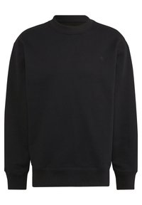 Svart sweatshirt med rund hals, ribbade ärmslut och nederkant, tillverkad av mjukt tyg. Har en diskret logotyp på bröstet. Enkelt mönster.