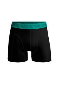 Melni bokseršorti ar mīkstu tirkīza jostu, uz kuras ir teksts "MUCHACHO MALO." Gluda materiāla ar pieguļošu dizainu un šūšanas detaļām.