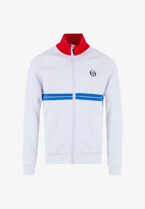 Biela bundá na zips s červeným golierom, modrými horizontálnymi prúžkami na hrudi a okrúhlym logom na ľavej strane. Vyrobená z hladkej tkaniny.