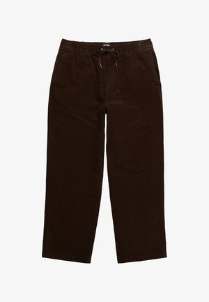 Pantalones de pana marrón con un corte relajado, cinturilla elástica y cordón, que cuentan con bolsillos laterales y una textura suave.