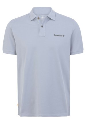 Light blue polo shirt with a ribbed collar, two-button placket, and Timberland logo embroidered on the left chest. Made of textured fabric.