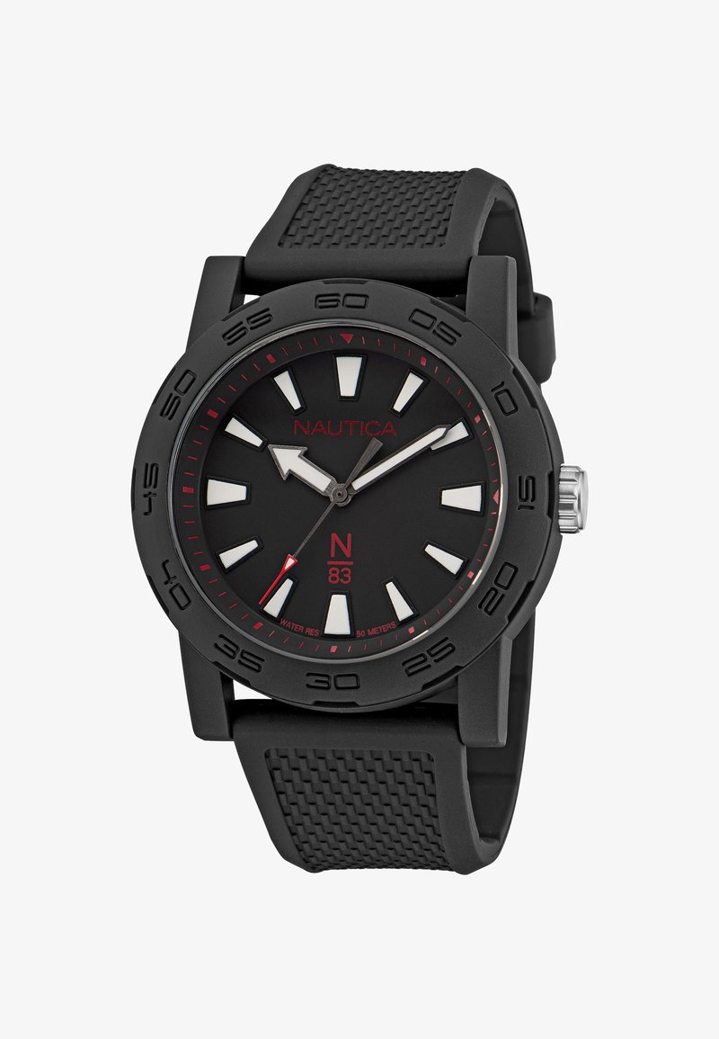 Musta sünteetiline kell ümmarguse korpusega, helendavad valged tunni markerid, punased aktsendid ja tekstuuriga must kummirihm. Veekindel kuni 50 meetrit.