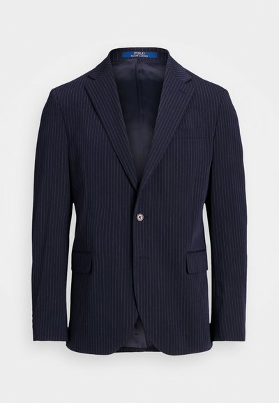 Navy prugasta suknja iz tkanine, z značilnim ovratnikom, dvema sprednjima žeepoma, enojnim zapiranjem na gumb in satenasto notranjostjo.