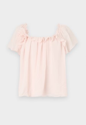 Light pink blouse with ruffled neckline and short, puffed sleeves. Soft fabric with floral accent on the left shoulder. Relaxed fit.