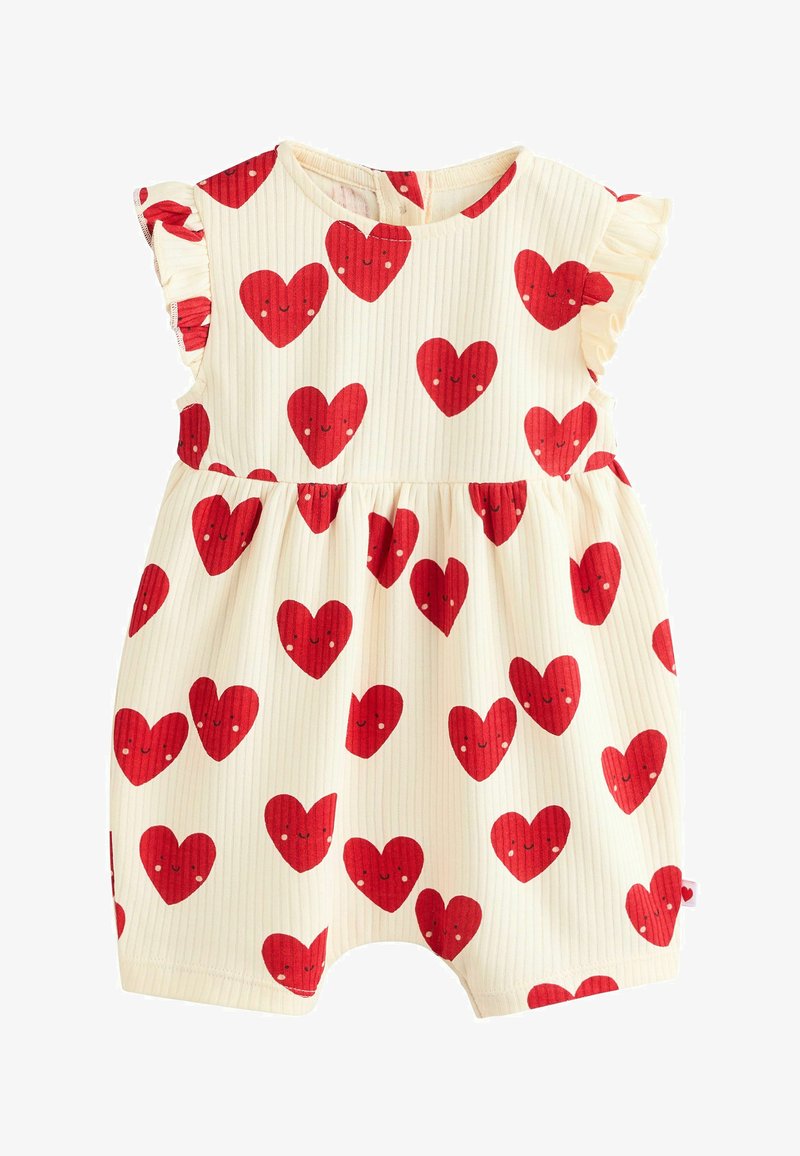 Une combinaison légère en crème avec des motifs de cœurs rouges et des visages souriants. Texture à rayures verticales, manches courtes à volants et taille froncée.