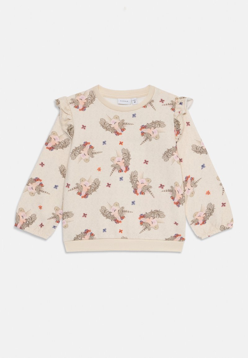 Beige pitkähihaisen taaperon collegepaita, jossa on röyhelösangat ja painettu yksisarviskasvojen sekä pienten värikkäiden kukkien kuvio.