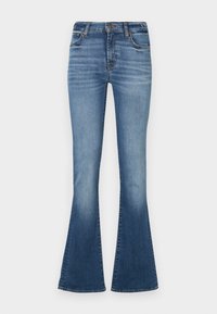 Blugi flared din denim albastru, cu talie medie, decolorare mai deschisă pe coapse și un design clasic cu cinci buzunare.