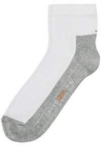 Hvide ankelstrømper med grå hæl og tå. Har ribbet kant og "sport" logo i orange på siden. Lavet af et blødt, tekstureret materiale.