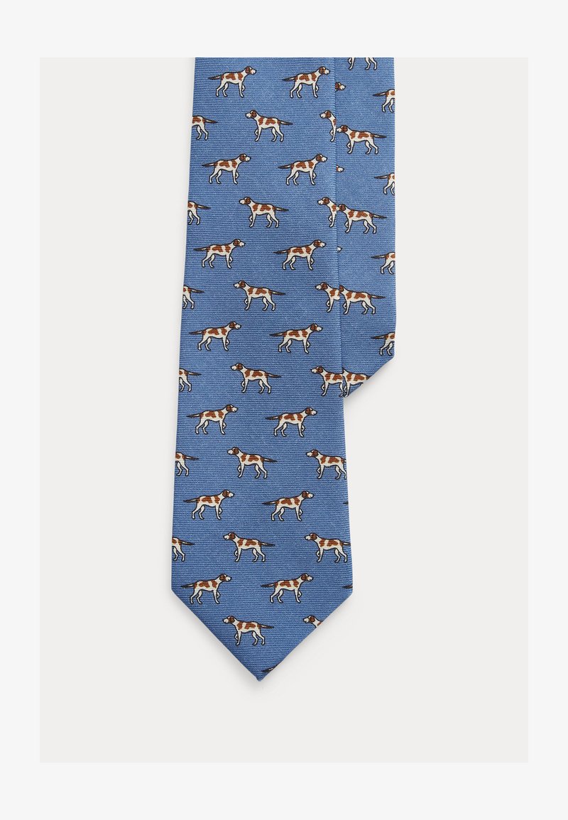 Niebieski krawat z powtarzającym się wzorem brązowych i białych psów. Wykonany z teksturowanej tkaniny z zaostrzonym końcem.