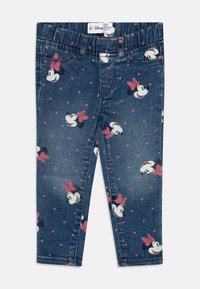 Leggings de mezclilla azul con un estampado de Minnie Mouse en toda la prenda y lunares rosas. Tienen una cinturilla elástica para mayor comodidad.