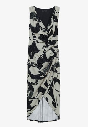 Robe sans manches avec un décolleté drapé, motif floral noir sur fond crème, avec une fente latérale et des détails froncés.