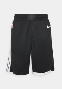 Shorts de basketball noirs en tissu mesh respirant. Dotés d'un logo Nike, d'un emblème NBA, de fentes latérales et de bandes blanches en accent à l'ourlet.