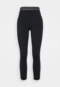 Leggings negros de tejido elástico, con una cintura alta y dos rayas plateadas en la parte superior. Textura suave y diseño ajustado.