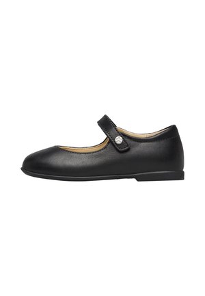 Chaussure Mary Jane en cuir noir avec un bout arrondi, semelle plate en caoutchouc et une seule sangle réglable dotée d'une boucle en métal argenté.
