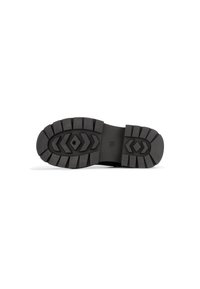 Suela de bota de goma negra con surcos profundos, punta redondeada y un diseño de costura a lo largo de los lados para mayor durabilidad y agarre.