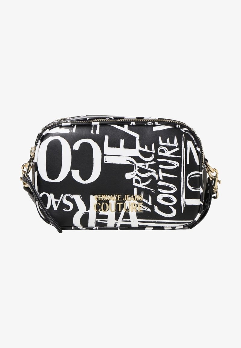 Sac en bandoulière noir en simili cuir avec texte graphique blanc, quincaillerie dorée, fermeture zippée et bandoulière amovible.