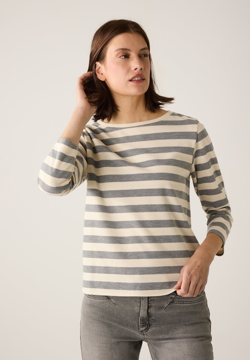 Gestreifte Langarmbluse in hellem Creme und Grau. Weicher Baumwollstoff mit lockerer Passform und rundem Halsausschnitt. Dezente horizontale Streifen.