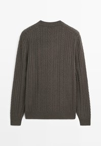Brown cable-knit sweater with a crew neckline, featuring vertical ribbing and textured patterns. Long sleeves with ribbed cuffs.