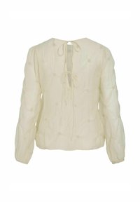 Kremowa bluzka z długimi rękawami, z wiązaniem z tyłu, teksturowana tkanina, podkreślone marszczeniami akcenty oraz małe haftowane węzły na całej powierzchni.