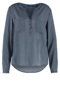 Blouse à manches longues bleu marine avec petit motif circulaire blanc, col en V avec boutons, deux poches poitrine et ourlet arrondi.