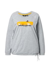 Felpa grigia chiaro a maniche lunghe con striature di vernice gialla e testo nero "MAGIC FEELING", con un piccolo cuore nero sopra il testo.