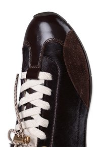 Brown leather sneaker with glossy accent, textured brown suede panel, white laces, metal eyelets, and a rubber sole.