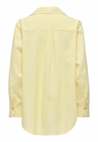 Chemise à manches longues jaune pâle avec poignets boutonnés, pli au dos et col classique, vue de dos sur fond blanc.