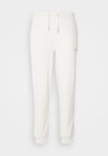 MONOLOGO - Pantaloni sportivi - ivory