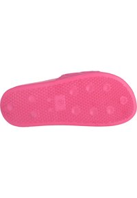 Roze rubberen zool met gestructureerde patronen, verhogingen en een gladde afwerking. Beschikt over een logo in het midden.