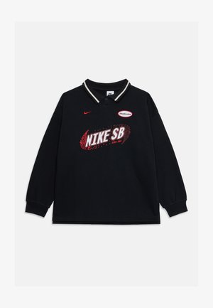 Svart långärmad polo med en vit och röd randig krage, med en stor röd "NIKE SB" grafik och logotypapplikation på bröstet.