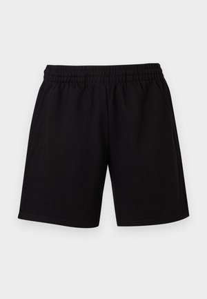 Sorte, ledige shorts med elastisk midjebånd og sidelommer, vist mot en enkel lys bakgrunn.