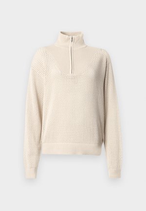 Pullover beige chiaro con zip, dotato di un colletto strutturato, caratterizzato da un motivo in rete testurizzato, polsini e vita a coste.