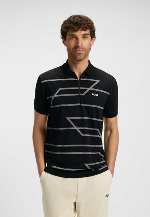 Short-sleeve black polo shirt with metallic gray geometric stripes and a zip placket, featuring a small "BOSS" logo on the left chest.