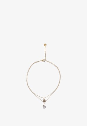 Gouden laagjesketting met delicate kettingen, featuring een ronde hanger en een druppelvormige doorzichtige steen. Verstelbare sluiting voor een goede pasvorm.