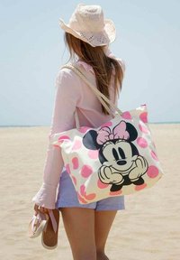 Katoenen tote bag met grote Minnie Mouse afbeelding, roze stippen en een crème achtergrond; voorzien van touwhandvatten en voldoende opbergruimte.