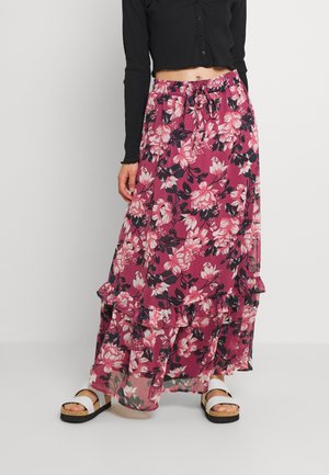Floral maxi skirt in deep pink and black, featuring ruffles and a drawstring waist, made from lightweight, flowy fabric.