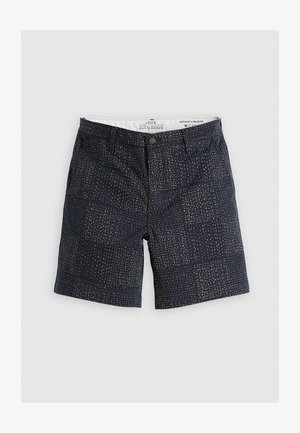 Pantalones cortos navy de algodón con un patrón texturizado de pequeños puntos amarillos. Presentan bolsillos frontales, pasadores para cinturón y cierre de cremallera.