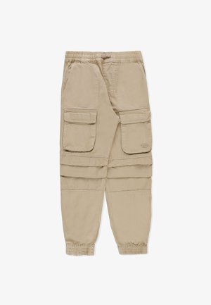 Pantaloni cargo beige realizzati in tessuto leggero, dotati di due ampie tasche anteriori e polsini elasticizzati alle caviglie. Vita piatta e vestibilità rilassata.
